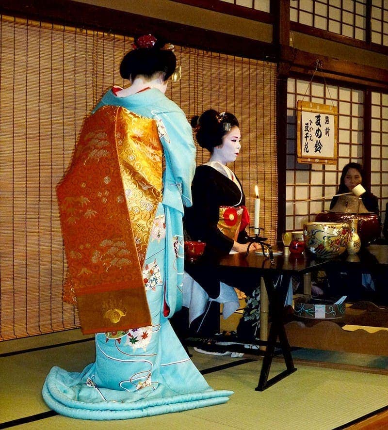 Geisha making matcha - a Japanese tea in the traditional style