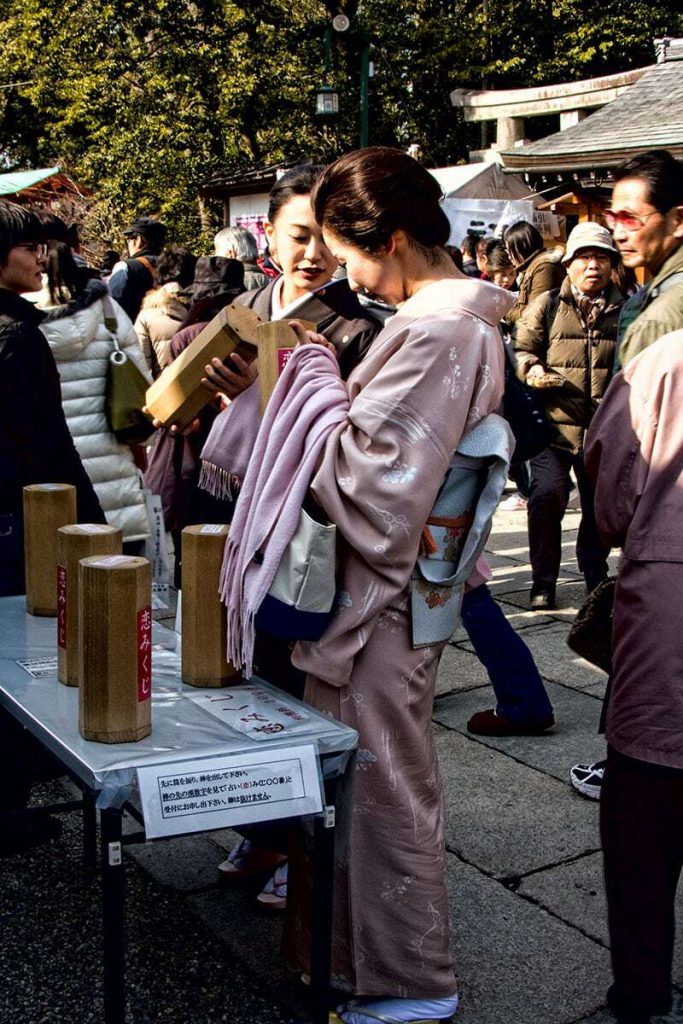 Selecting a fortune at Yasaka Shrine