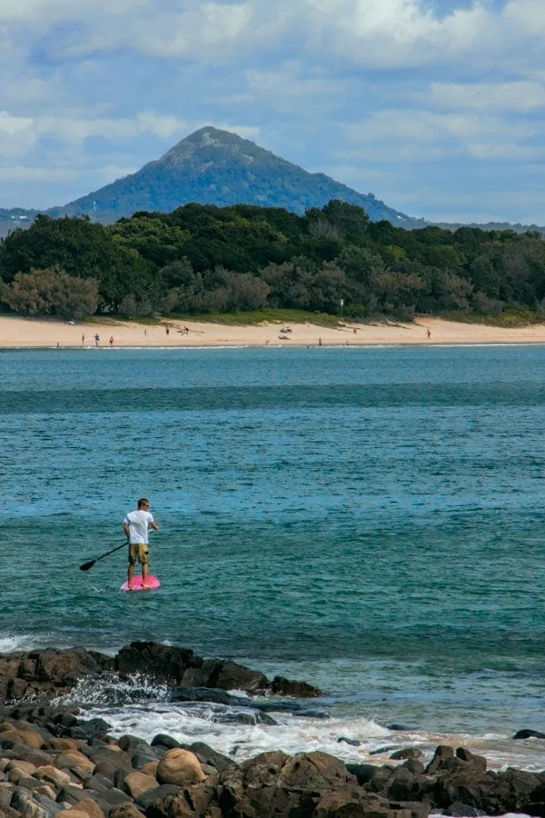 Stand up paddle boarding in Noosa - another great spot for a long weekend escape in Australia