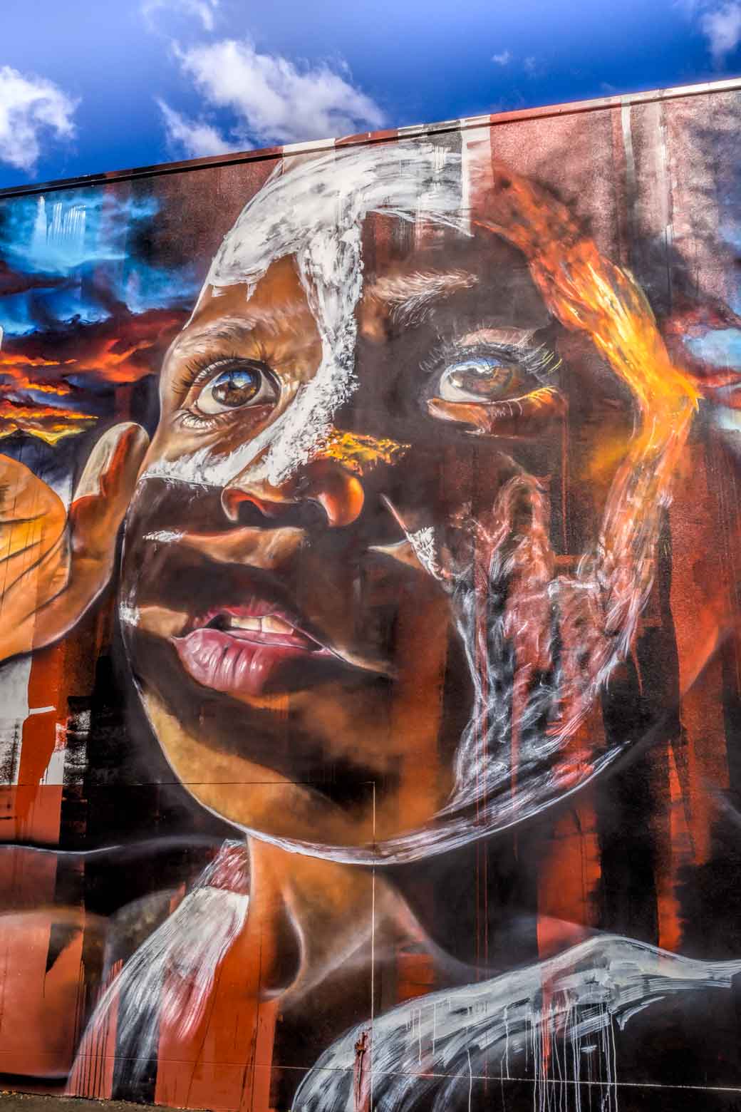 Street art mural of young boys face by Adnate in Toowoomba