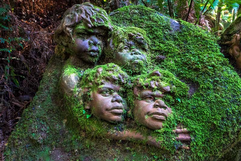 Large mossy pottery sculpture at William Ricketts Sanctuary featuring  children