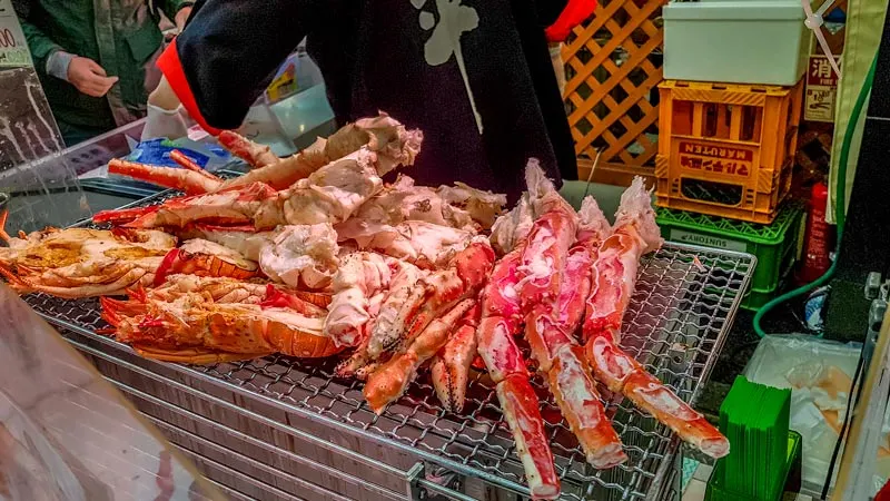 Giant crab legs on the grill at Kuromon Market