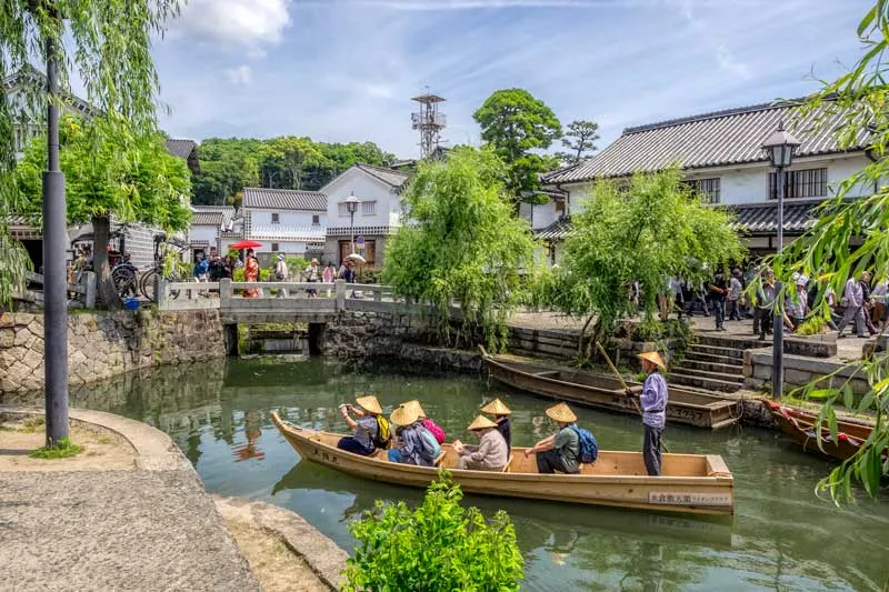 Traditional boat on canal at Kurashiki Bikan, Japan