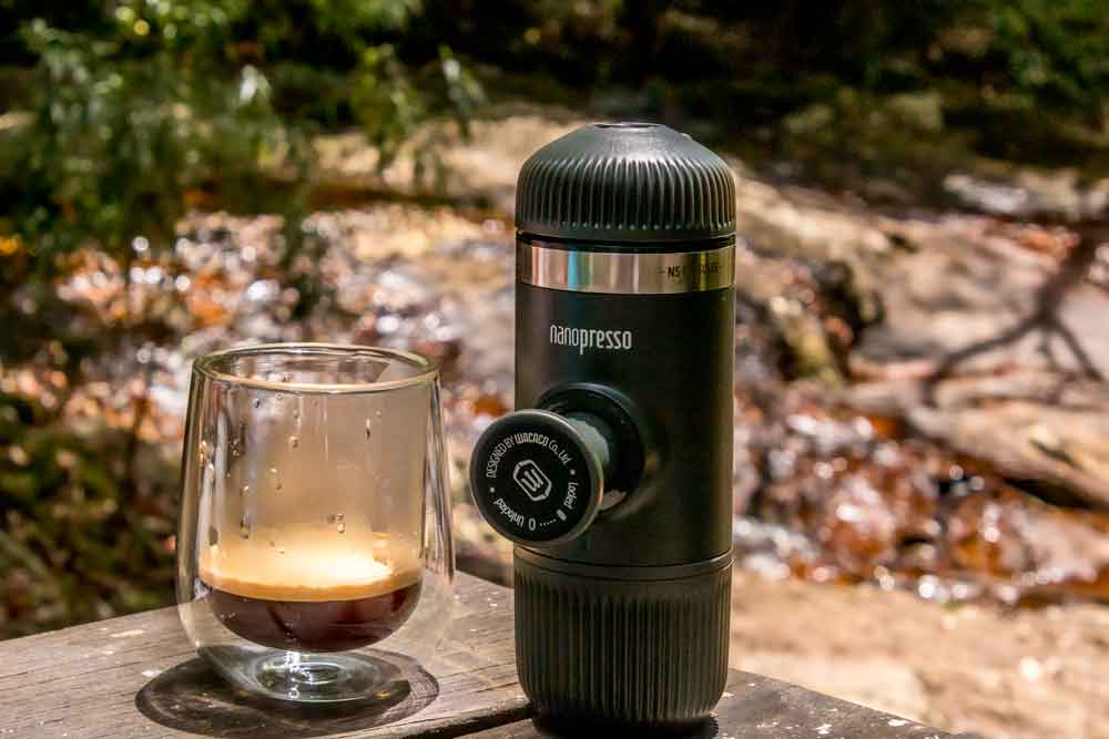 Nanopresso coffee press on rock beside stream in Springbrook National Park