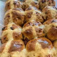 tray of glazed hot cross buns direct from the oven