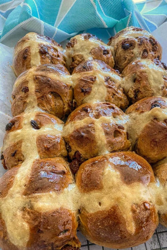 tray of glazed hot cross buns direct from the oven