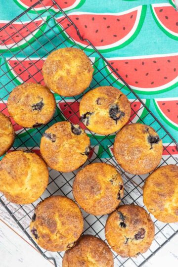 Blueberry muffins with cinnamon crunch on cooling rack