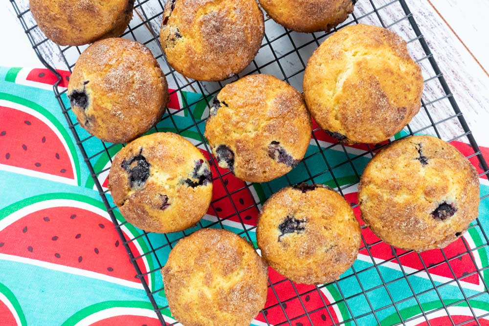 lemon and blueberry muffins on wire rack