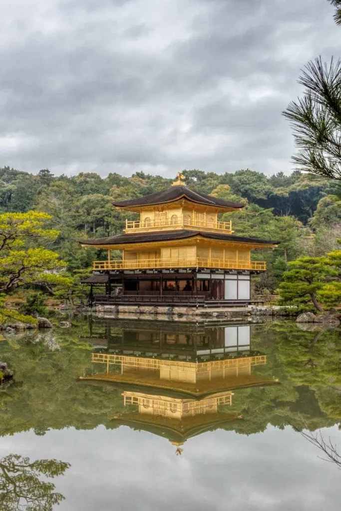 Golden pavilion reflected in the mirror pond at Kinkakuji