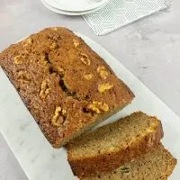 our easy banana loaf cut on marble serving tray