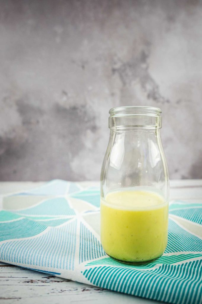Lime dressing in a glass bottle