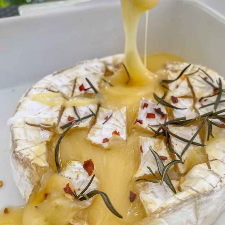 Baked camembert oozing melted cheese
