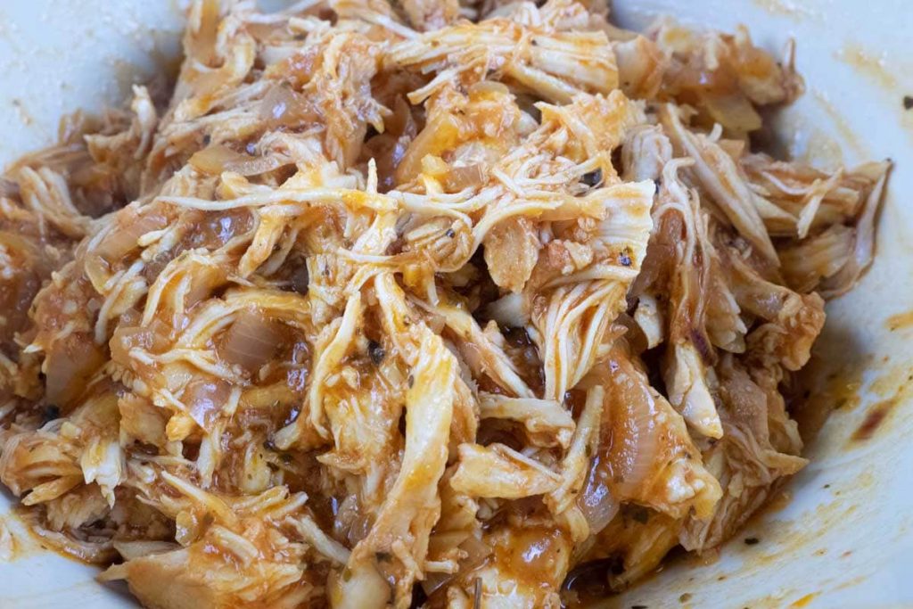 Slow cooked shredded chick with spicy sauce