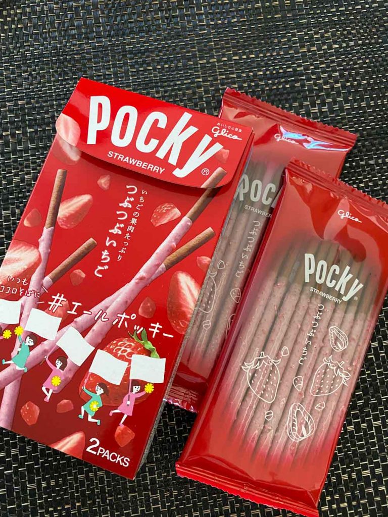 Chunky strawberry Pocky sticks on a cacao biscuit
