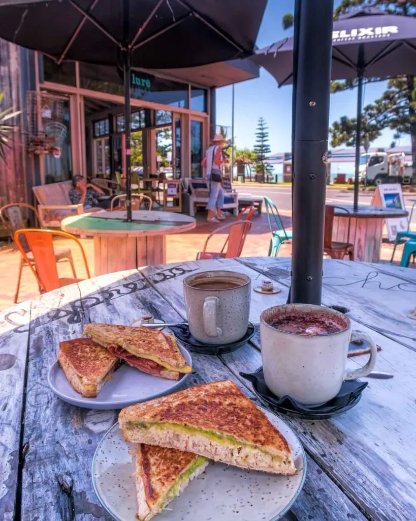 Toasted sandwiches and drinks on table at Lure Living in Yeppoon