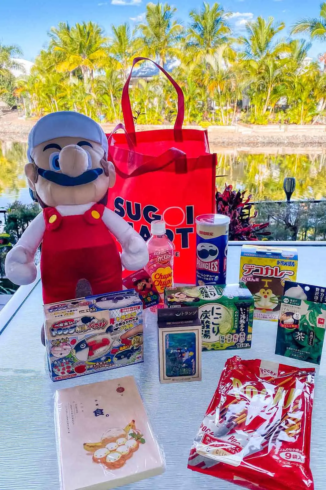 Sugoi lucky bag unpacked in front of lake and Palm Trees