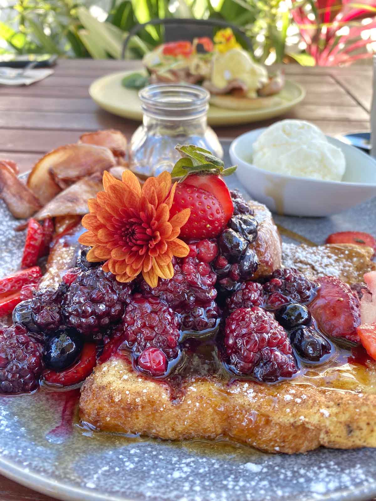 Berry french toast on wooden table at Dayman General Store Cafe