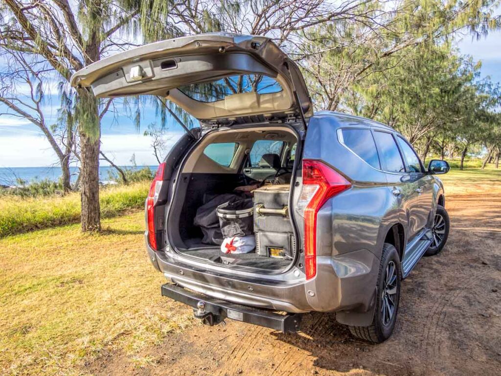 Road trip essentials - 4WD at beach with tailgate open