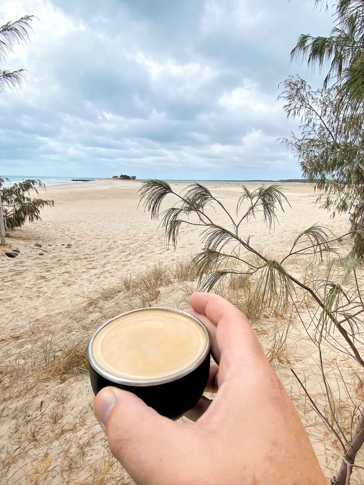 A smooth and robust espresso shot with thick layer of crema at beach