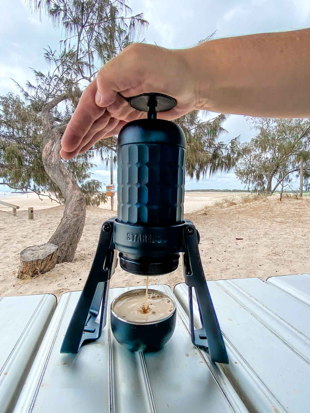 Extracting esspresso with Staresso machine at the beach