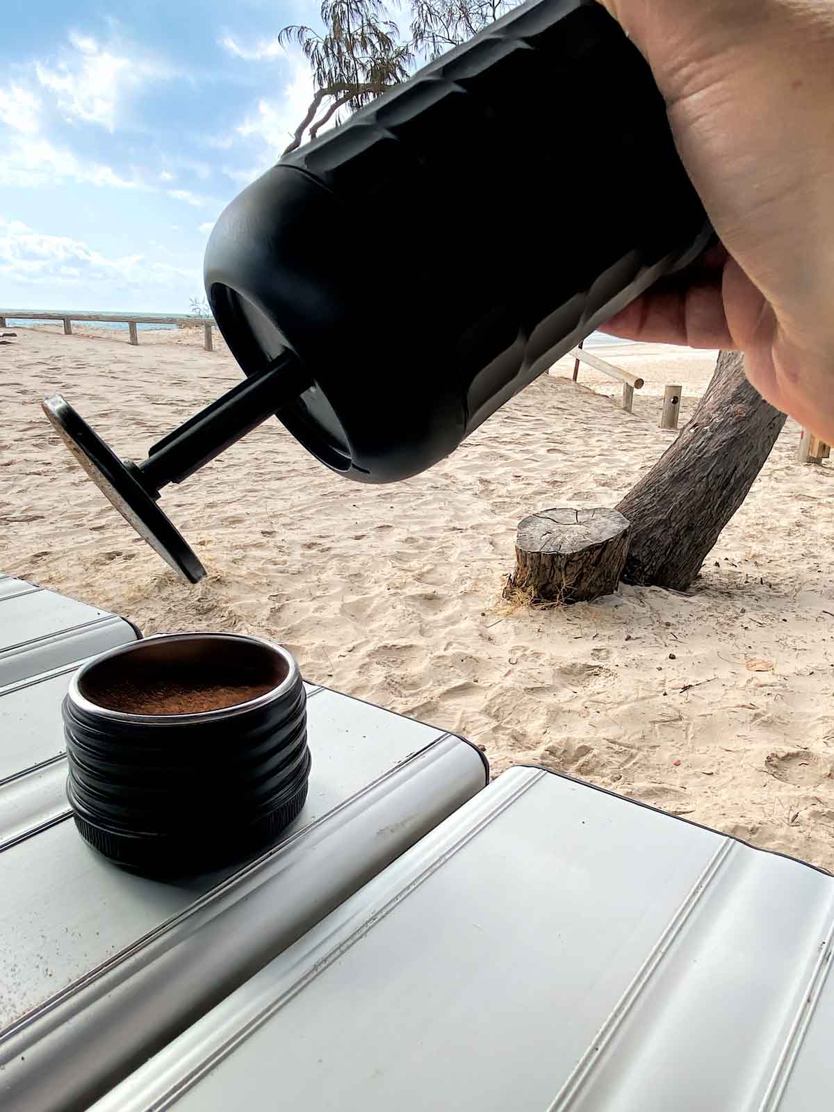 Using the pump top as a tamp for the espresso grounds